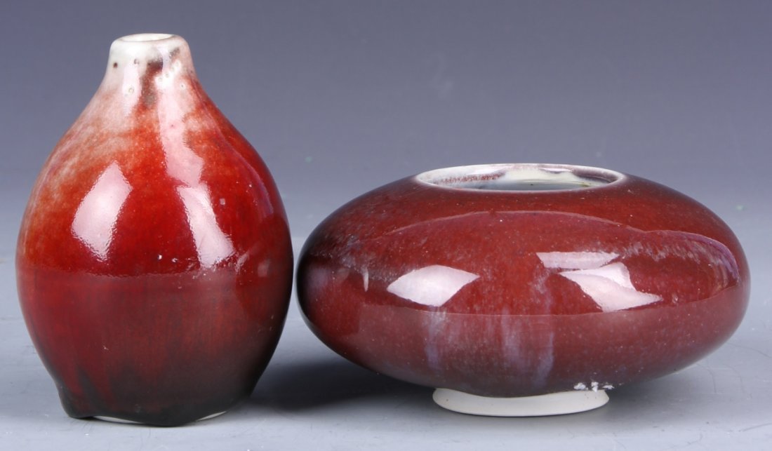 Chinese Ox-Blood Glazed Water Coup and Brushwasher: China, ox-blood glazed water coup and brush washer, water coup is in bulb form with a gradient red glaze, with the water coup in a shallow ovular form with a deep solid glaze. Height 3 in.