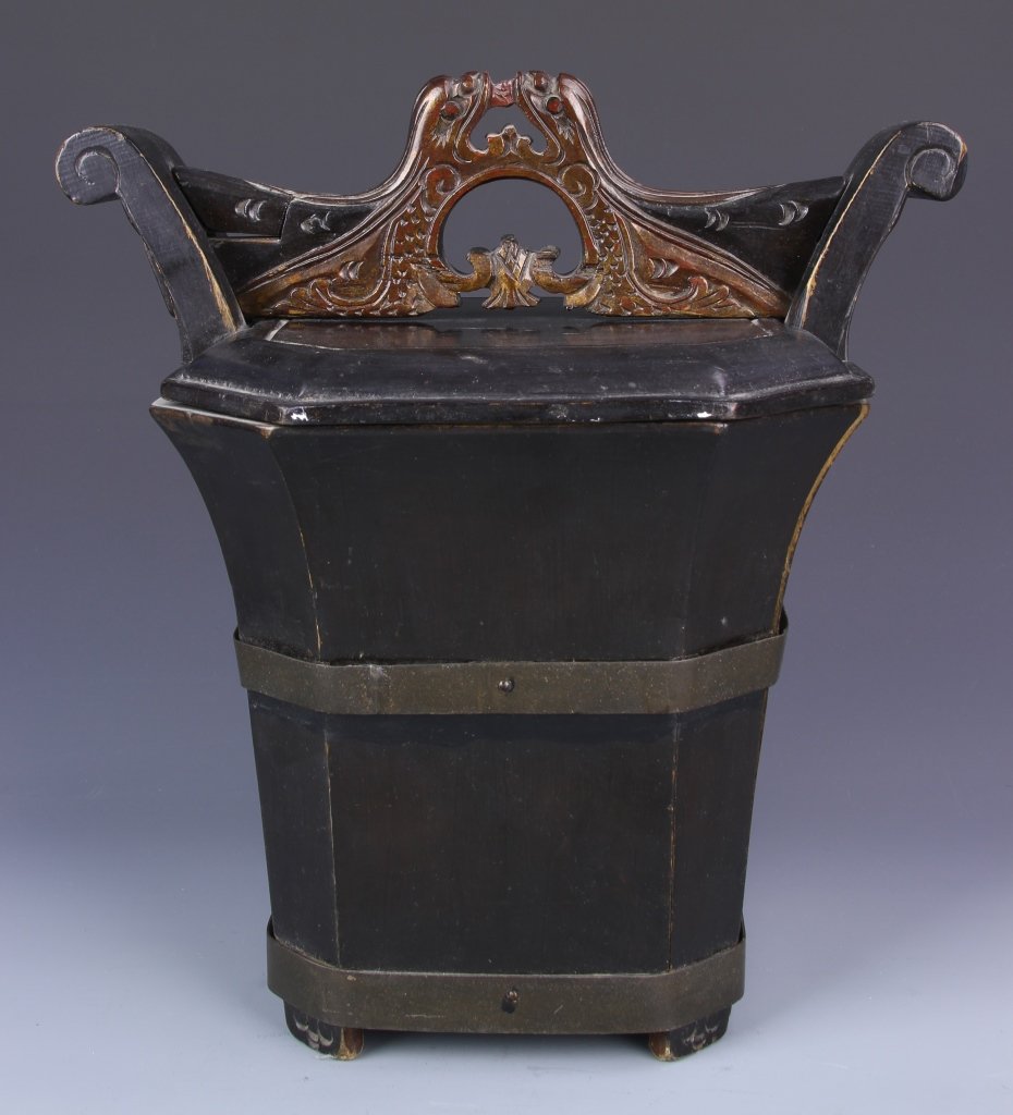 Chinese Nom Wood Tea Bucket: China, 19th C., nom wood tea bucket, dark stained wood with intricate carving on lid, metal bands around the body and the foot. Height 11 3/8 in.
