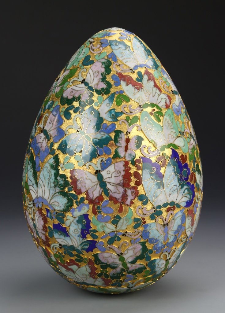 Chinese Cloisonne Egg: China, big cloisonne egg, decorated with brightly colored butterflies on gold ground. Height 10 in., Width 6 1/2 in.