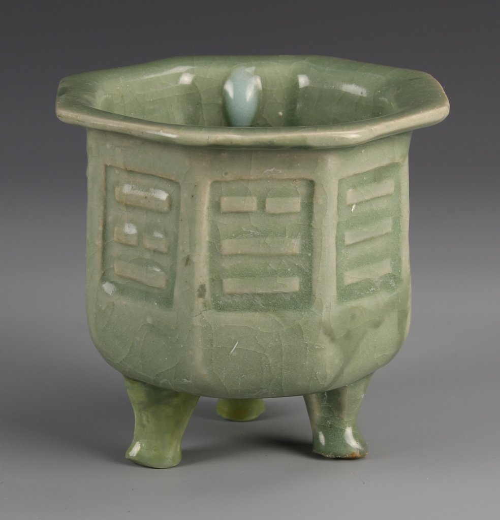 Chinese Lungquan Glazed Censer: China, Lungquan glazed censer, hexagonal form with octagonal flared lip, three panels in relief on front, with a rounded,ceramic footed base, Height 4 3/4 in.