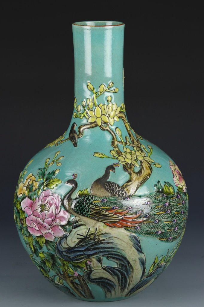 Chinese Famille Rose Vase: China, Late 19th C., robin's egg blue Famille Rose vase with molded decorations of birds surrounded by colorful flowering branches. Height 16 in., Width 10 in.