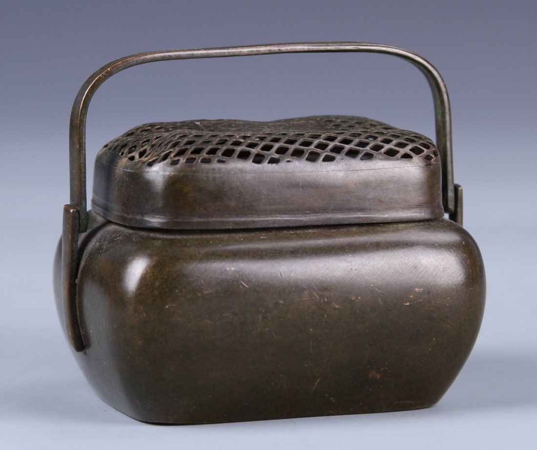 Chinese Bronze Hand Warmer: China, 19th C., bronze hand warmer, square in shape, bulbous shoulders with two flat ears attached to a square handle, incised auspicious patterns on cover, mark on bottom. Height 3 in., Width 3 1/4 i