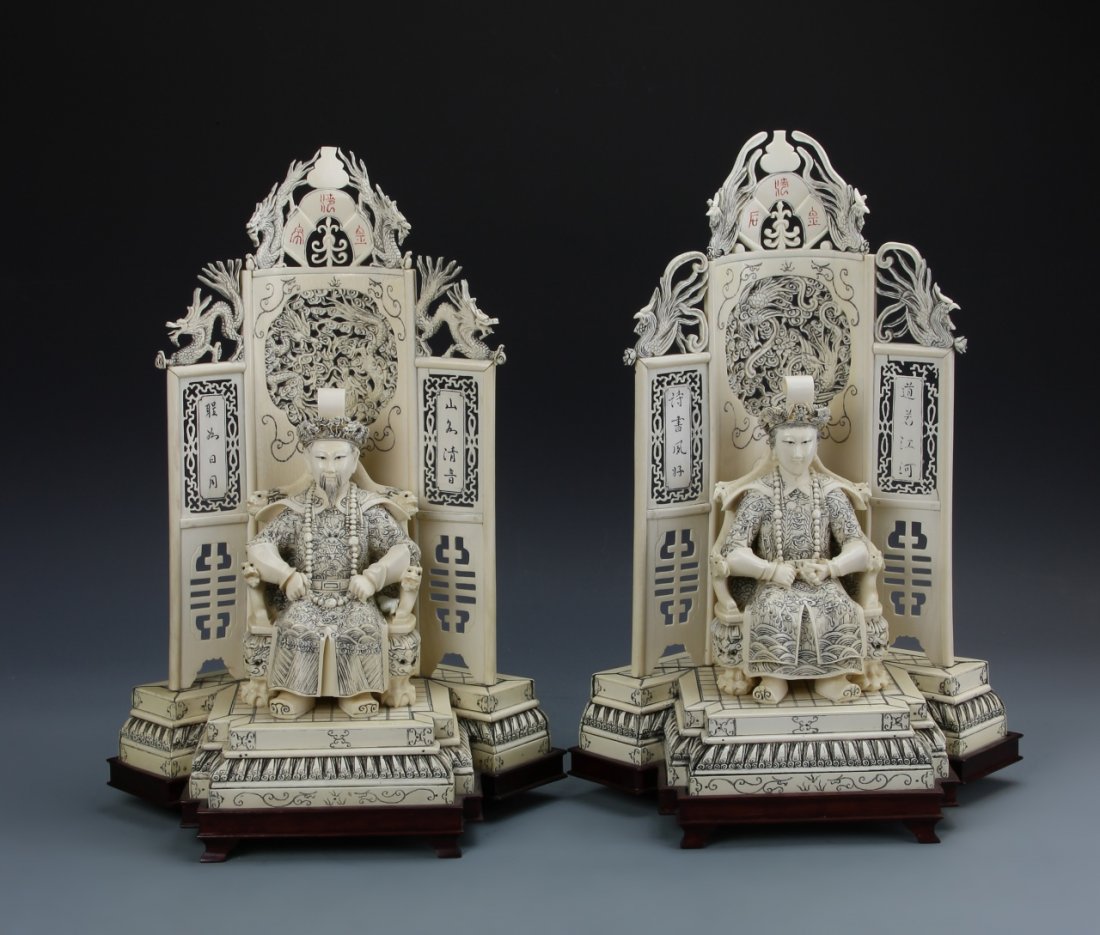 Pair of Chinese Bone Carved Shrines with Figures: China. 19th C., pair of bone carved shrines with figures, both robed men seated on dragon thrones on a raised platform, a large elaborate screen stands behind them decorated with creatures and auspici