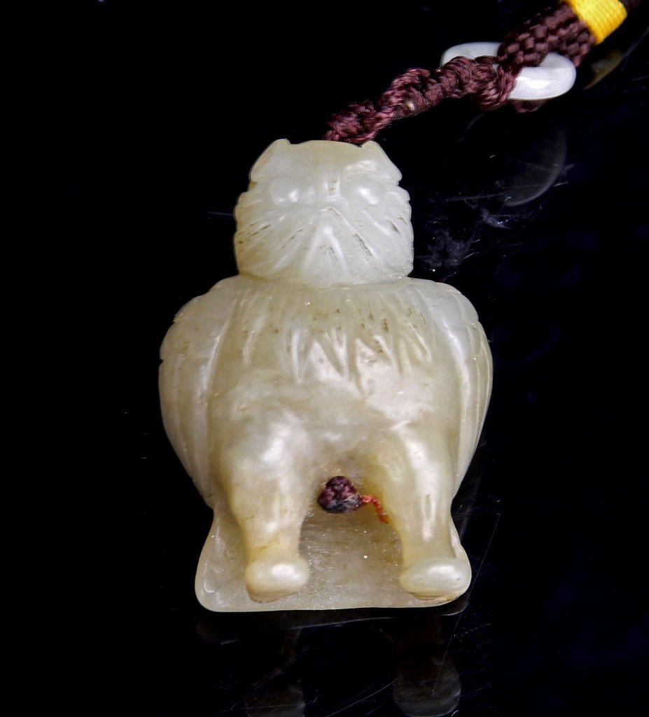 Chinese Jade Eagle Pendant: China, jade eagle pendant, carved into the standing form of the bird, great detail seen in the feathers, face and two strong legs. Height 1 1/2 in.