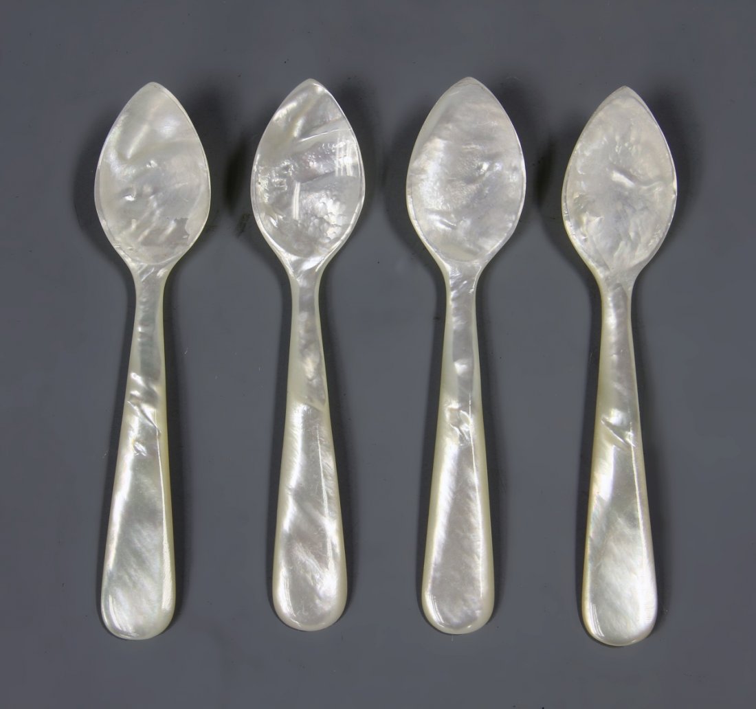 Four Chinese Mother of Pearl Spoons: China, 20th C., four spoons made of mother of pearl, in a white hue, with the natural striations of the shell, and iridescent quality. Length 4 3/4 in.