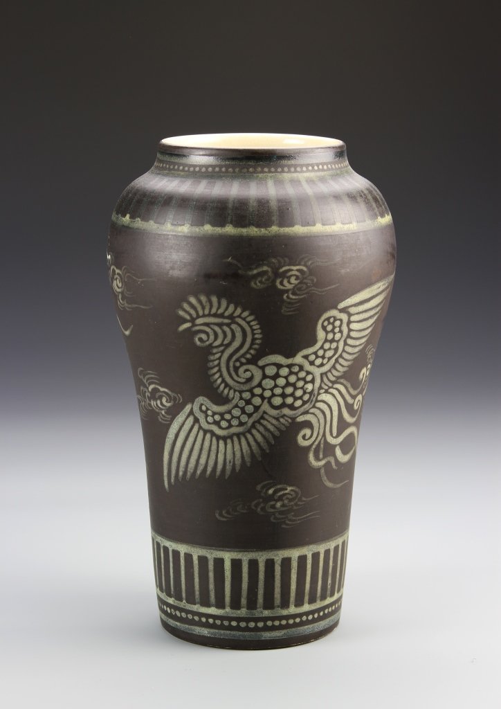 Japanese Black Vase: Japan, 19th C., black vase, with a high shoulder sloping to the base, stylized bird motifs, and linear details, mark on base. Height 10 in.