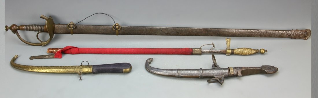 Pair of Daggers and Sword: Indonesia, pair of daggers. Length 2 inc. Broken early ladies sword marked "viva P10 1 X". Length 41 inc.