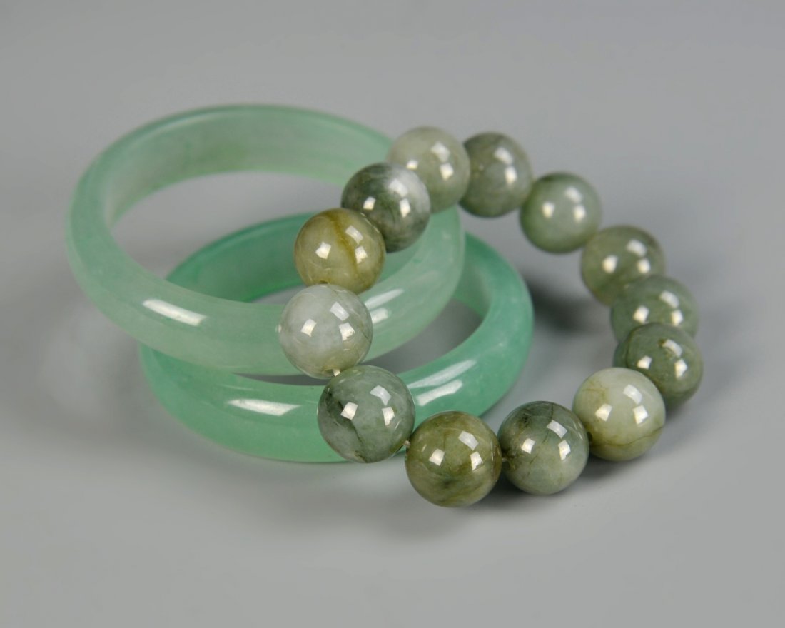 Chinese Jade Bangle and Jade-Beaded Bracelet: China, a pair of jade bangle and jade-beaded bracelet. Diameter 2 3/4 in.