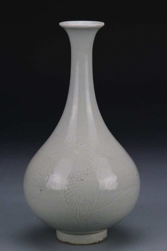 Chinese White Glazed Yuhuchunping Vase: China, 18-19th C., white glazed Yuhuchunping vase, with incised dragon motifs, in a white glazed tone, with a smooth surface, mark on base. Height 9 in.
