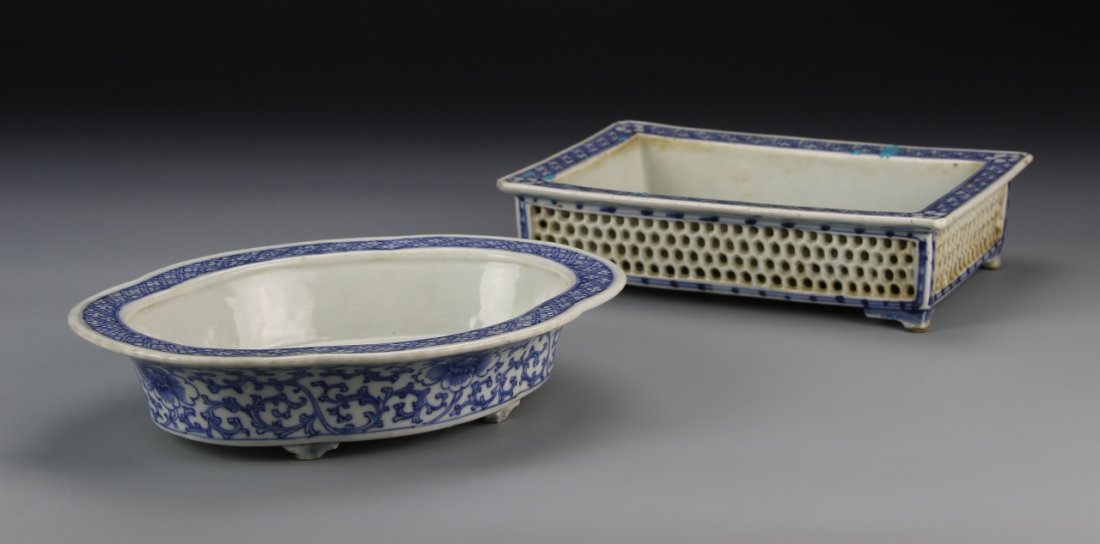 Two Chinese Blue and White Flower Pots: China, 19th C., two blue and white flower pots, one in oval form with plant motifs along the outside, another rectangular shaped with pierced sides. Largest Length 9 1/4 in., Width 6 1/4 in., Height 1