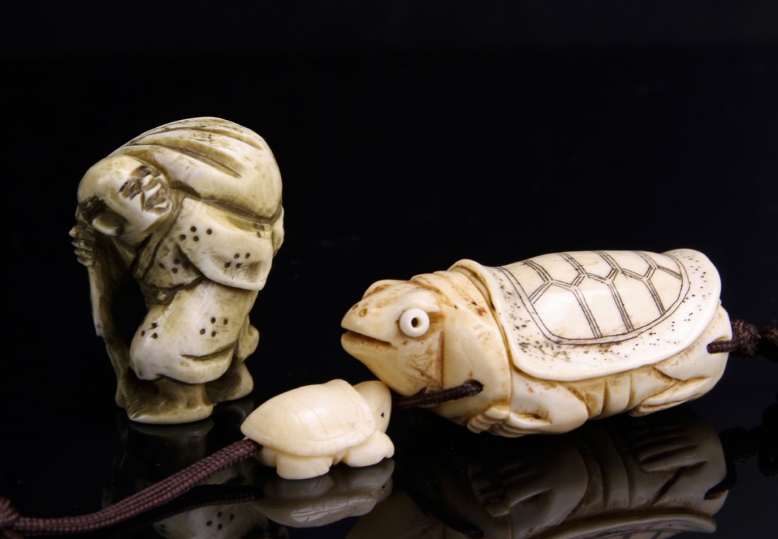 Japanese Carved Man and Turtle: Japan, 19th C., two pieces of man and turtle, large turtle white in color with carved face and body, shell details inked in black, man carved with black inked details. Height 2 1/2 in. Federal regulat