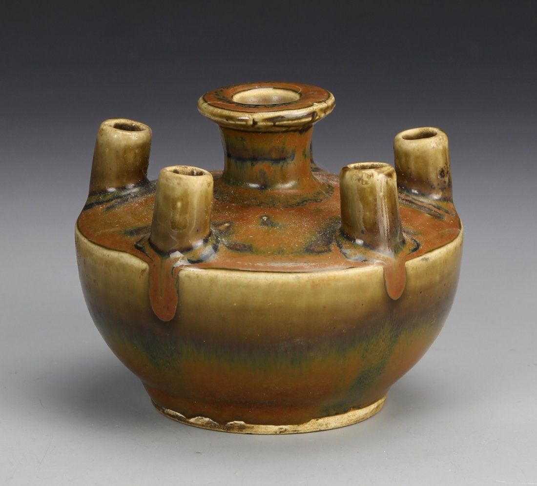 Chinese Black Glazed Vase: China, black glazed vase, compressed body with flanged mouth and five apertures on short neck, covered with rich russet colored glaze. Diameter 4 1/4 in.