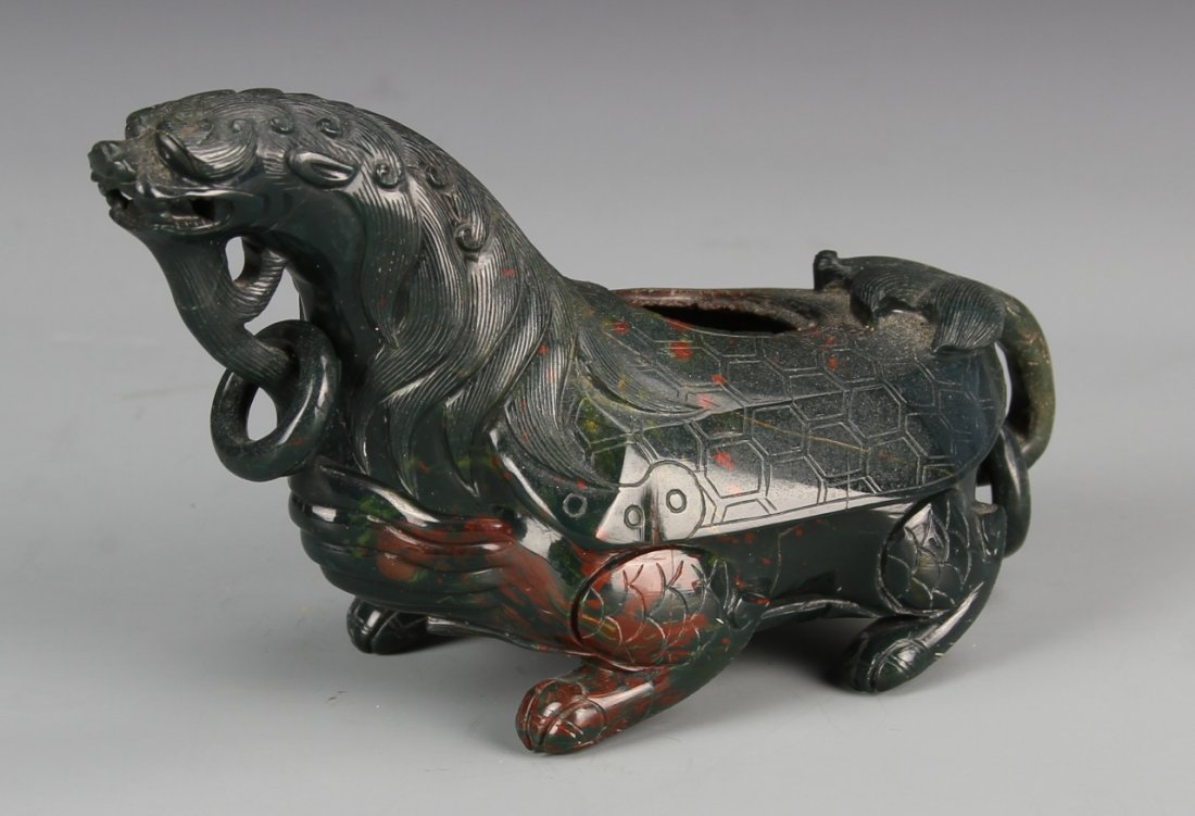 Chinese Jade Dragon Turtle: China, jade dragon turtle, in reclining position, with geometric and linear details, carved ring, and striations in the stone, mark on base. Length 5 1/2 in.