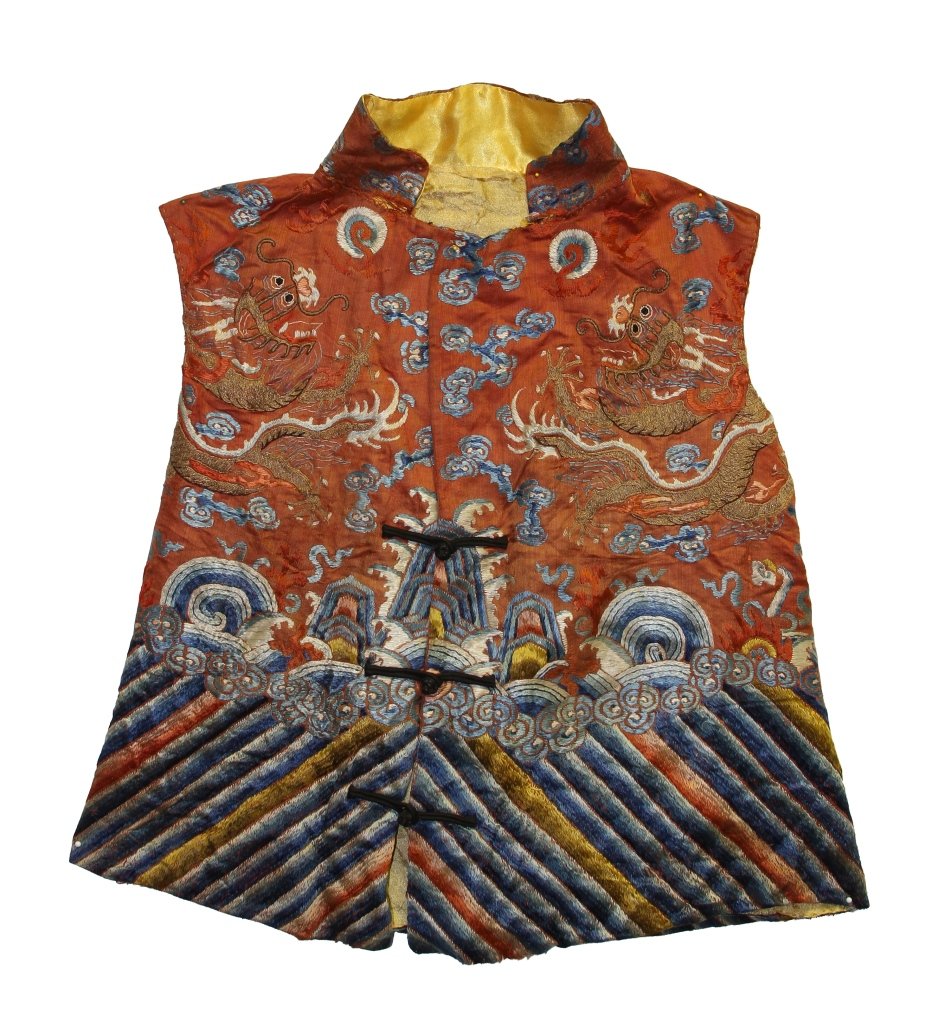 Chinese Silk Embroidered Vest: China, 19th C., silk embroidered vest, expertly crafted and decorated with five clawed serpentine dragons, auspicious symbols, with stylized clouds and diagonal striations at bottom, with the words "b