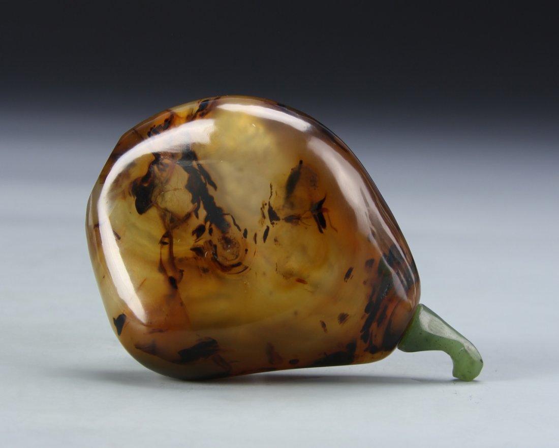 Chinese Agate Snuff Bottle: China, 19th C., agate snuff bottle, in an organic form, in a brown mottled hue, with striations in the stone, and a smooth, high shine surface. Height 2 3/4 in.