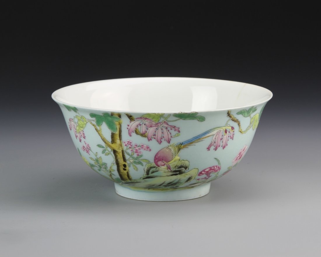 Chinese Famille Rose Bowl: China, ROC Period, Famille Rose bowl, with a light blue ground, colorful floral motifs, and white glazed interior, minor hairline crack, Yongzhen mark. Width 5 3/4 in., Height 2 5/8 in.