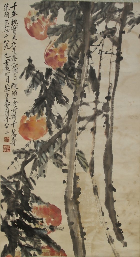 Chinese Scroll Painting of Flowers: China, scroll painting, abstractly rendered, with blooming peach branches, with character signature and red seals, attributed to Wu Changshuo. Height 45 in., Width 24 in.