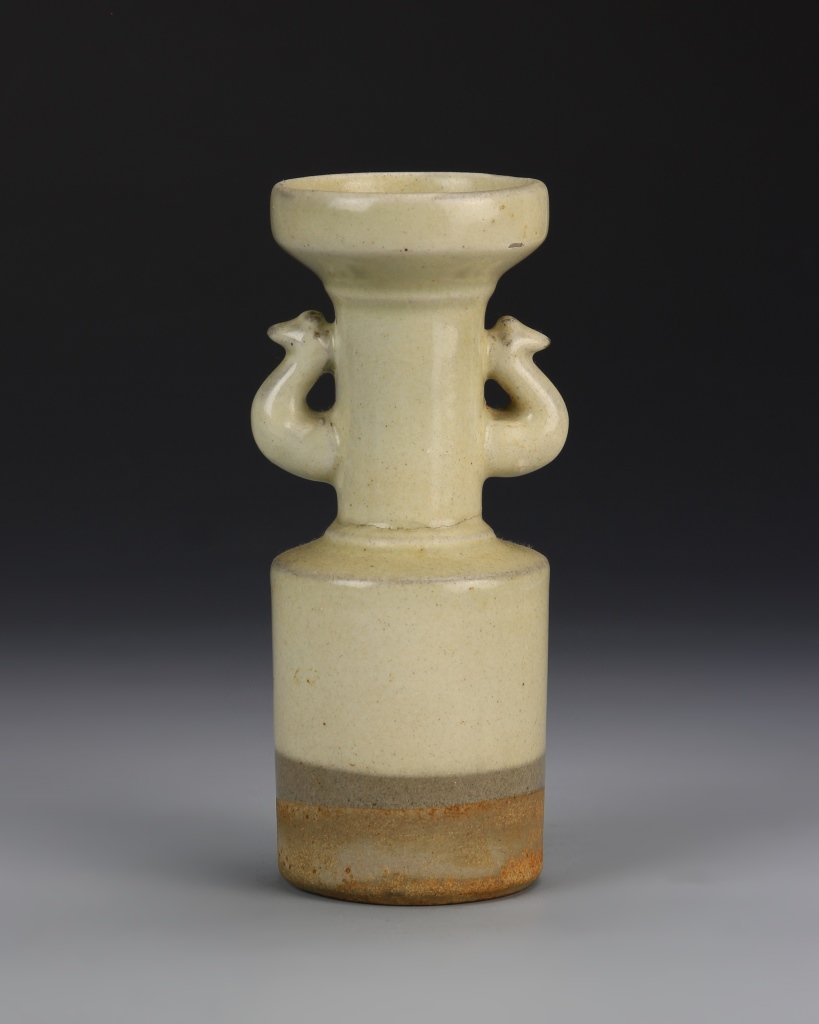 Chinese Lungquan Ware Vase: China, Song Dynasty, Lungquan ware vase, in cylindrical form, with tapered neck and flared rim, flat base, and two decorative ears. Height 5 3/4 in.