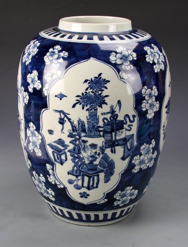 Chinese Blue and White Jar: China, blue and white jar, painted with an image of vases holding flowers and plants, geometric banded decoration at the shoulder and base. Height 14 in.
