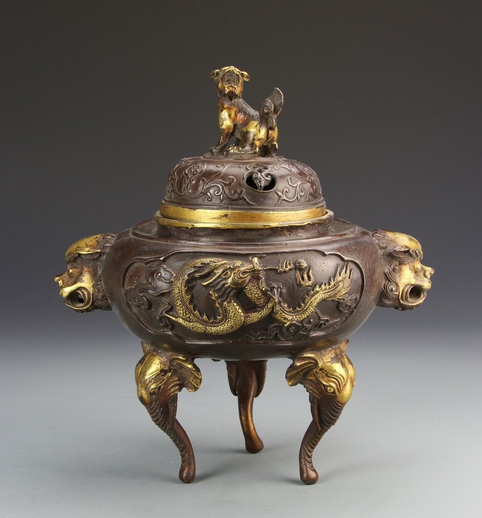 Chinese Bronze Covered Incense Burner: China, bronze covered incense burner, rounded incense burner, with three gilt elephant heads as feet, and two gilt mythical creature faces as ears, gilt dragon on burner, with mythical creature as lid