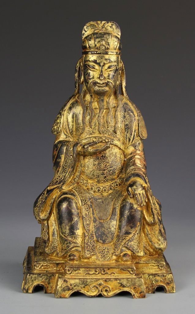 Chinese Gilt Bronze Figure: China, gilt bronze figure, in a seated position with draping robes on a tiered square base. Height 11 in.