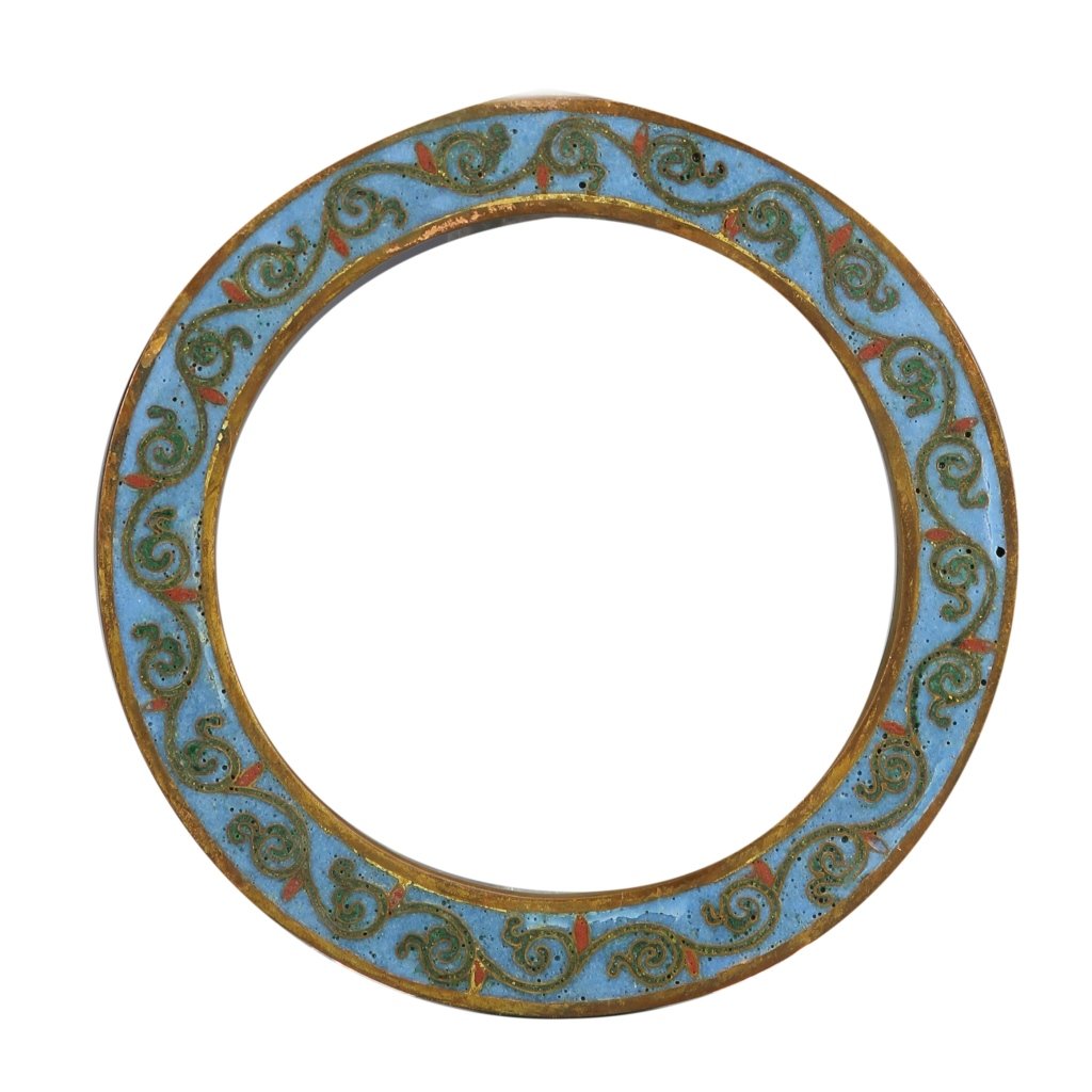 Chinese Cloisonne Piece: China, circular cloisonne piece, scrolling organic forms of green and red amongst a blue background, bordered on both the inside and outside with metal. Diameter 4 in.