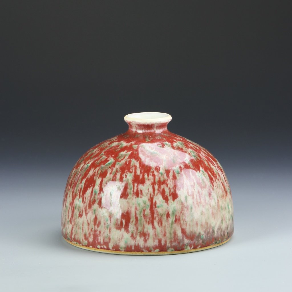 Chinese Peach Blossom Water Coup: China, ROC Period, peach blossom water coup, with tapered rim, in a mottled red and light green hue, and high shine surface, with double ring mark. Height 5 1/4 in., Width 3 3/4 in.
