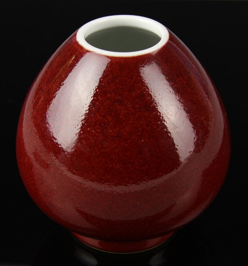 Chinese Oxblood Glazed Water Coup: China, ROC Period, oxblood glazed water coup, small base, egg shaped body and small lip, polished surface, with Yongzheng mark. Height 3 1/4 in.