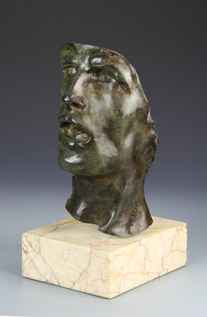 Cast Bronze Face of a Man (1 of 2)
