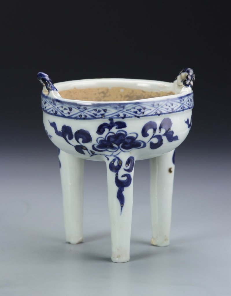 Chinese Blue and White Tripod Censer: China, Ming Period, blue and white tripod censer, two raised handles, round body on three high legs, painted in blue floral design. Height 4 1/2 in., Width 4 in.