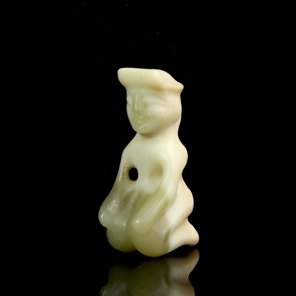 Chinese Jade Figure: China, jade figure, carved to resemble a figure in a kneeling position with their arms resting on knees. Height 1 7/8 in. Provenance: Private Collection from Cape Cod, MA.