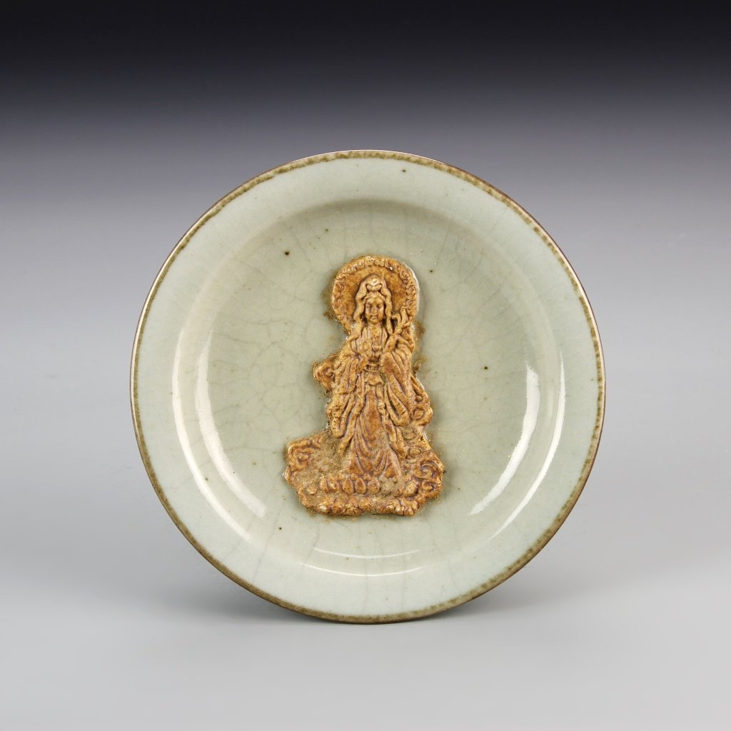 Chinese Antique Lungquan Ware Plate: China, antique Lungquan ware plate, white crackle-glazed plate with a central figure wearing a flowing shawl and robes in a brown glaze. Diameter 5 1/2 in.