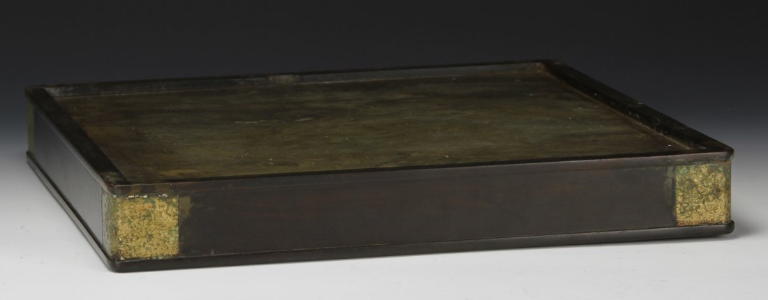 Chinese Wood Tray: China, wood tray, rectangular wood tray with gold-colored embellishments on corners. Width 12 1/4 in., Height 1 3/4 in.