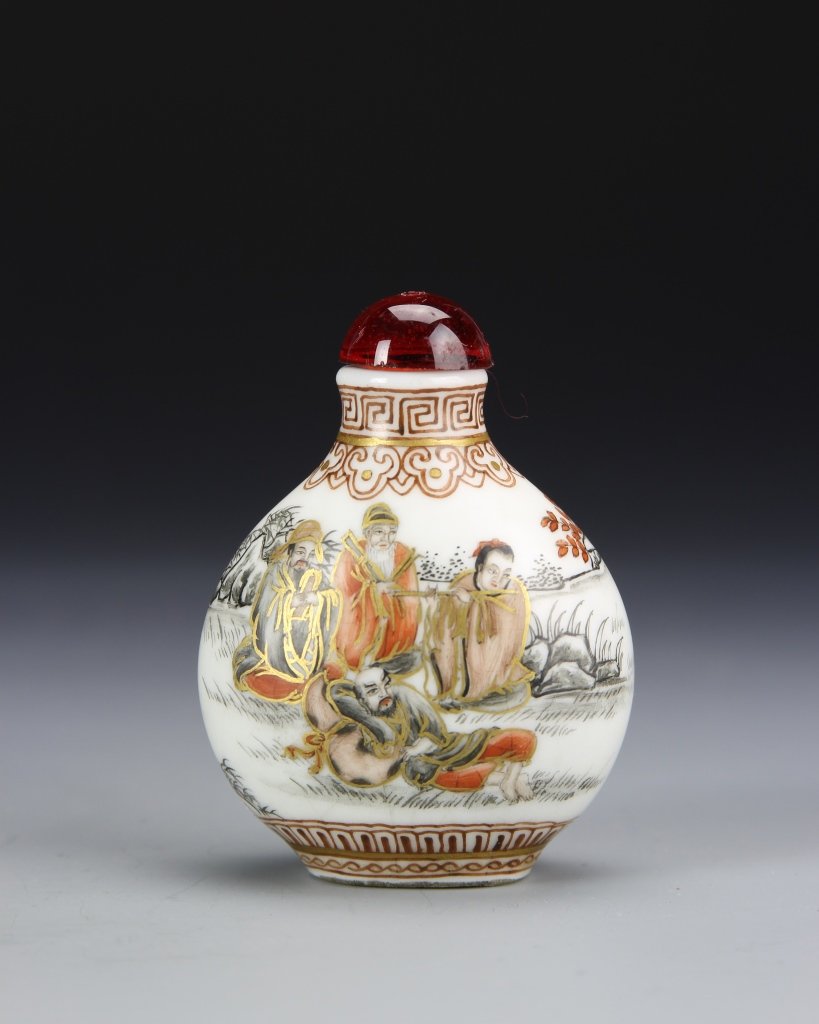 Chinese Famille Rose Snuff Bottle: China, ROC Period, Famille Rose snuff bottle, showing elaborately dressed figures, one reclining, in a landscape, with gilt details, mark on base. Height 2 1/2 in.
