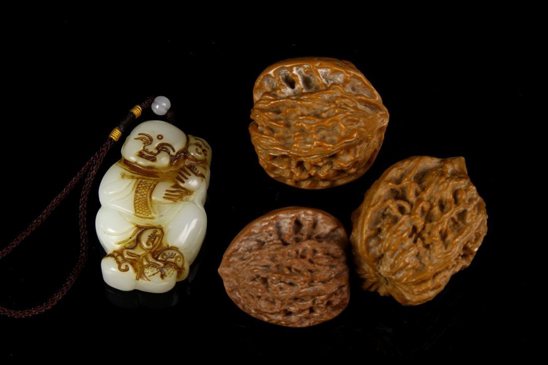 Chinese Walnuts and Jade Pendant: China, three walnuts and a jade pendant. Height 2 3/4 in.