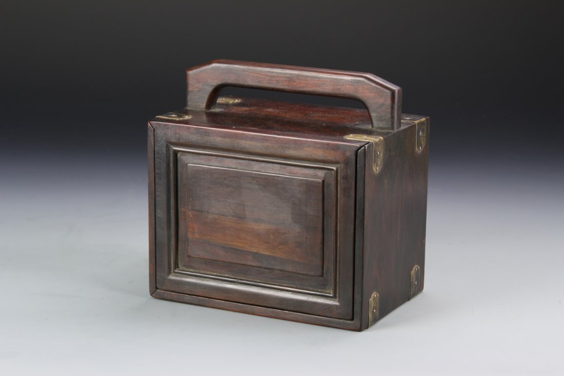 Chinese Rosewood Jewelry Box: China, ROC Period, rosewood jewelry box, rectangular form, with four draws, and high handle, in dark stain and metal details. Height 7 in., Length 4 5/8 in., Width 6 3/4 in.