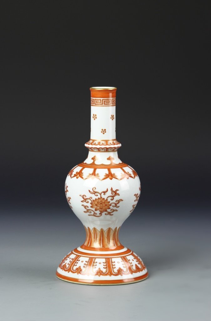 Chinese Famille Rose Vase: China, Famille Rose vase,Flared out foot tapering in to garlic body, above the shoulders at the base of the neck is a expanded band going up into the long cylindrical neck, Qianlong mark. Height 9 3/4