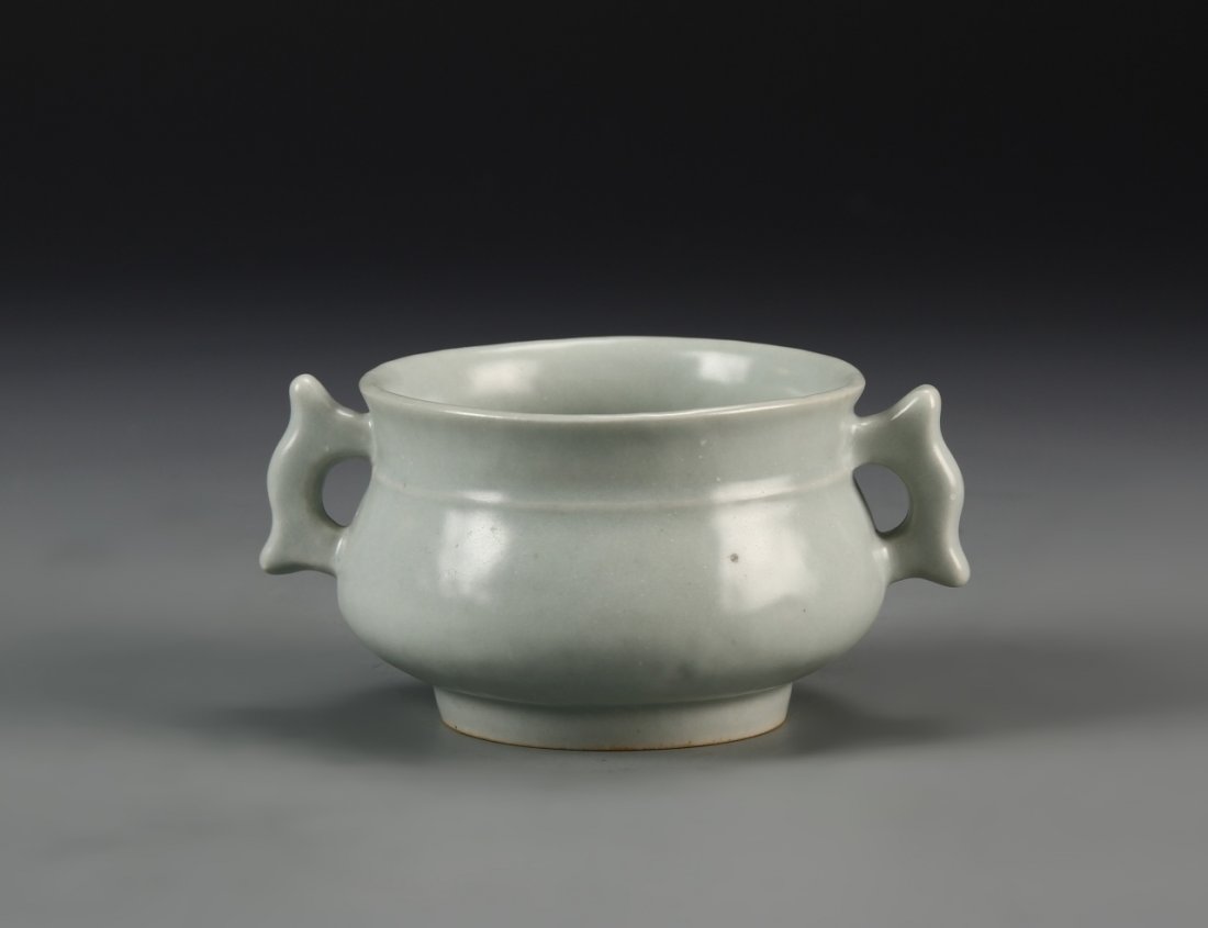 Chinese Antique Lungquan Censer: China, antique, Lungquan censer, round bulbous body on footed base, with decorative ears on both sides, pale grey glaze throughout. Width 5 in., Height 2 1/2 in.