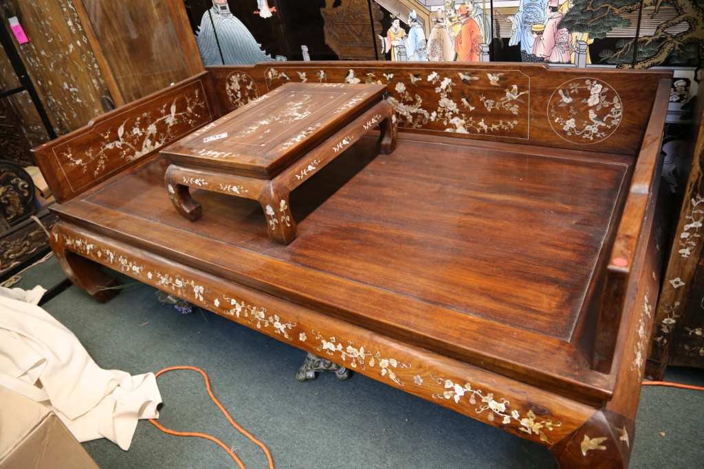 Chinese Old Huanghuali Dragon Bed: Including a small table. Shells inlaid on the surface. Size 82" long x 44" x 29" high.