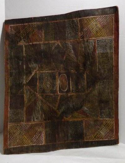 Aboriginal Bark Painting: A fine old aboriginal bark painting from the Northern territory, Australia. Old ochre and pigments in a geometric pattern with dot background. The remainder of a missionary label is attached on the ve