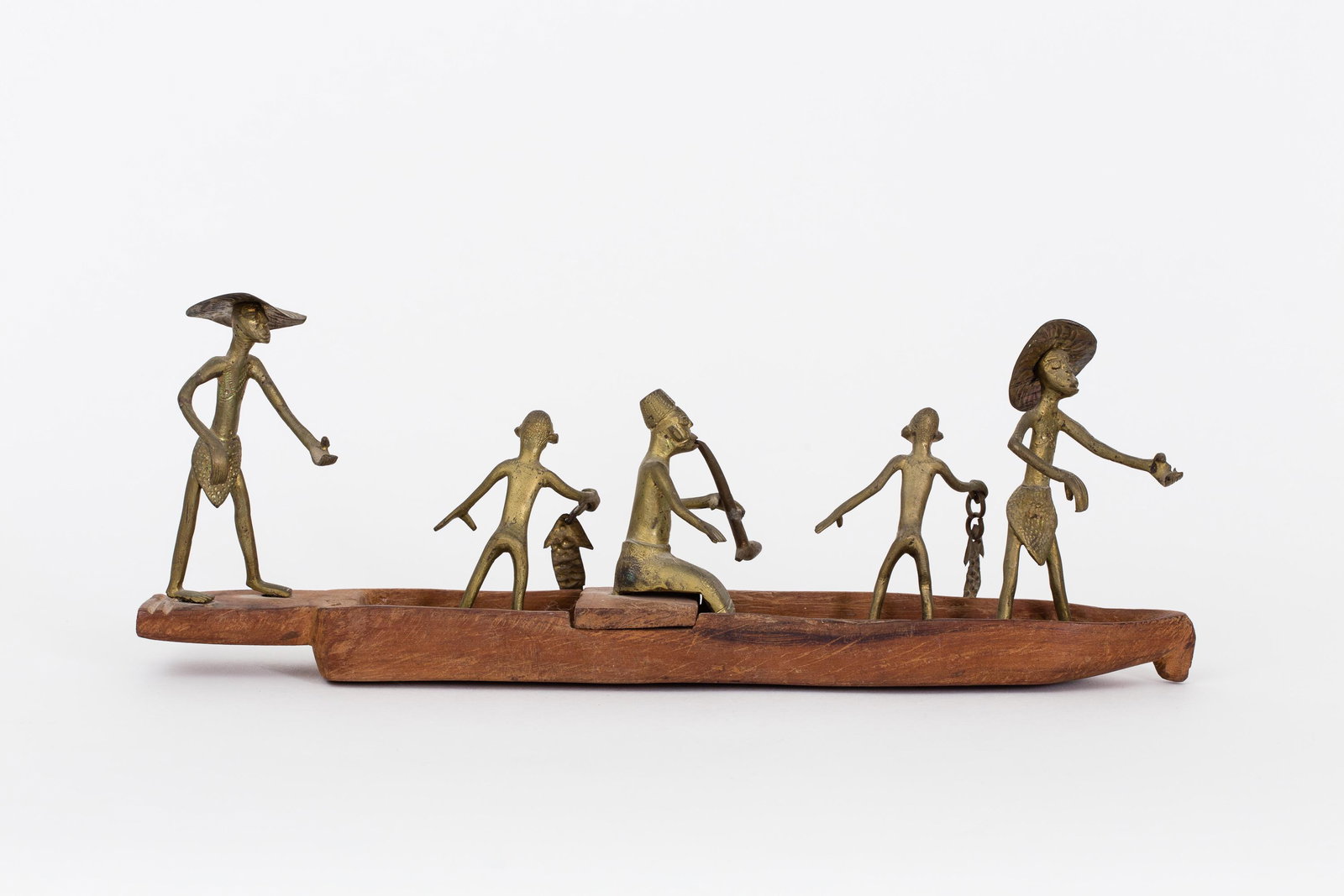 West African/Africa Dahomey Bronze, Nigeria: West African/Africa Dahomey Bronze Figures Fishing on Boat, early 20th Century Bronze and wood Dimensions: 16 1/4 (W) x 5 1/2 (H) x 3 1/2 (W) inches