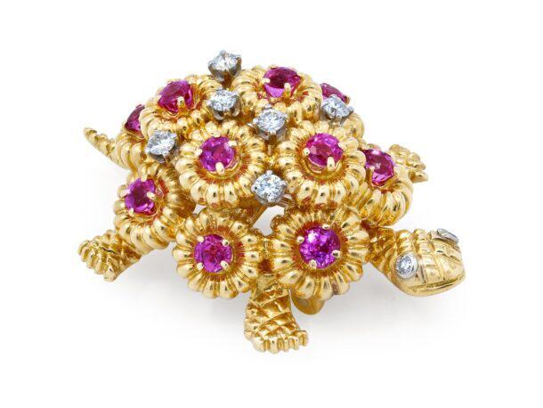 Ruby & Diamond Turtle Brooch: Designed as a realistic turtle, the shell with round rubies in a fluted gold bezel, accented with prong-set diamonds and diamond eyes, in 18k gold.