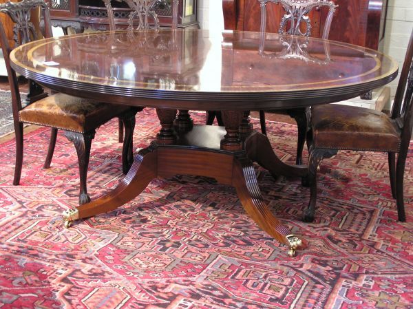 Round Sheraton Mahogany Dining Table: Custom made round Sheraton mahogany dining table with satin wood and ebony banding. Measures 72 inches in diameter and 30 inches tall. .