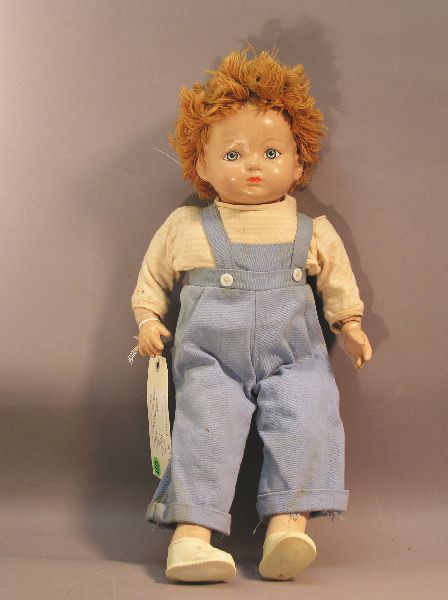 Annie Effanbee Doll: Annie Effanbee doll. Measures 18 inches tall. Crazing on face and hands.