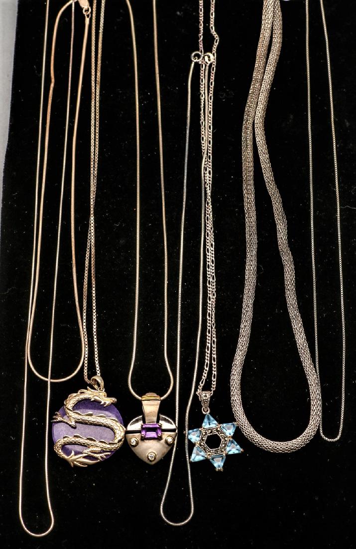 Box lot Sterling Silver Necklaces: Consists of 8 pieces. 3 chains marked Italy .925, one chain Italy, rope chain marked .925, three chains marked .925 one with dragon pendent marked .925, one with star pendent marked .925 and one with