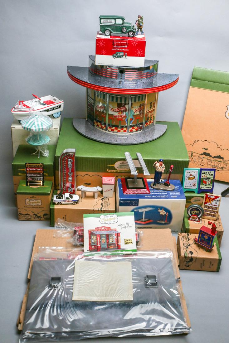 Hallmark Kiddie Car lot: Lot consists of Hallmark collectible Diner and related pieces, KC Garage and related pieces, 2 kiddie car boats (one in box). Refer to pictures.