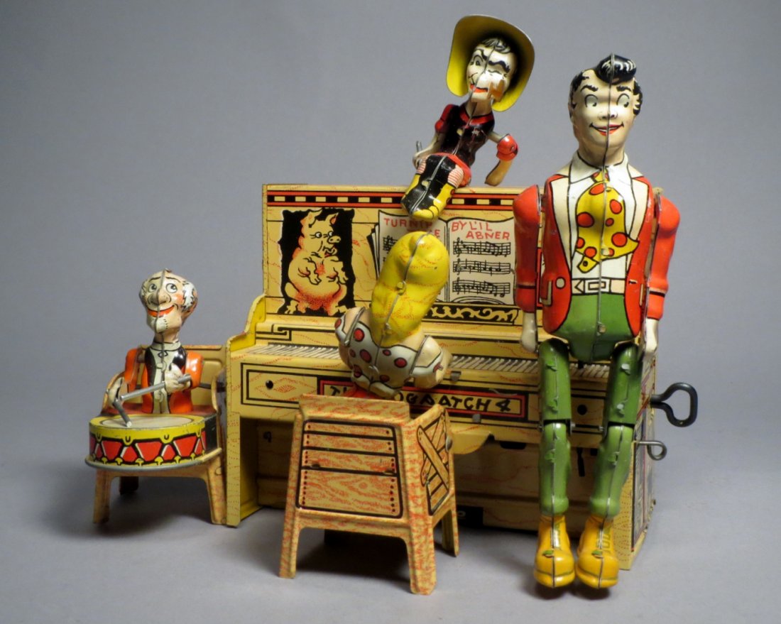 Little Abner His Dog Patch Band Wind Up Tin Toy Working: Nice tin wind up toy featuring Little Abner and his Dog Patch band. It is in good working condition. Size Approximately 10 inche by 8 inches.