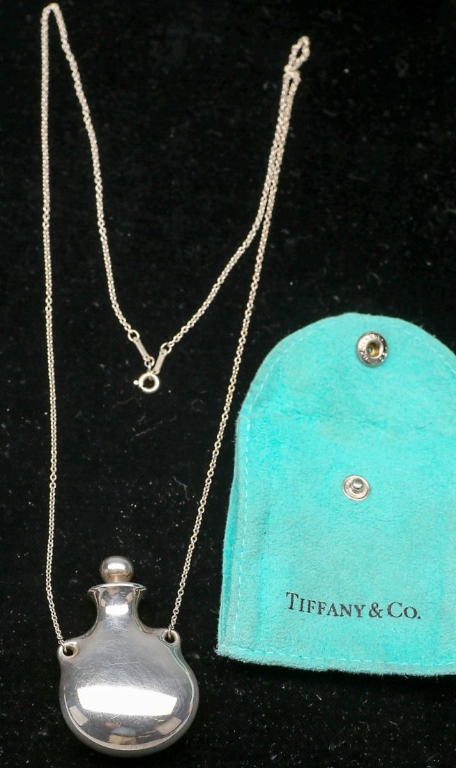 Elsa Peretti Tiffany Necklace Sterling Perfume Vessel: Tiffany necklace, designer Elsa Peretti, bottle is marked Tiffany & Co./ Peretti/925/Spain. China is also marked Tiffany & Co. Peretti/ 925. All is sterling in fine condition. This is a rare find with