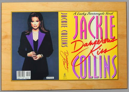 1st Ed. Publishers Gift Jackie Collins, Dangerous Kiss: Beautiful publishers gift of a 1st edition book cover of Jackie Collins, "Dangerous Kiss". The seductively beautiful, street-smart, and powerful Lucky Santangeloâ€¦ star of four of Jackie