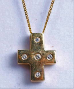 14K Yellow Gold and Diamond Cross Necklace, Worn By: Beautiful 14K yellow gold cross pendant with 5 round brilliant cut diamonds. Cross is marked 14K and is hanging from a delicate curb chain that measures approx 16" long. Clasp is marked 14K Italy with